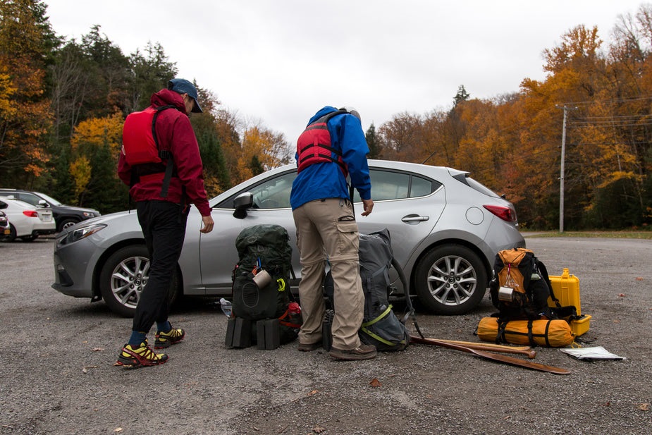 customizable luggage bags in front of car